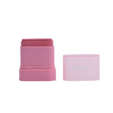 Pink cosmetic stick with a clear cap on a white background